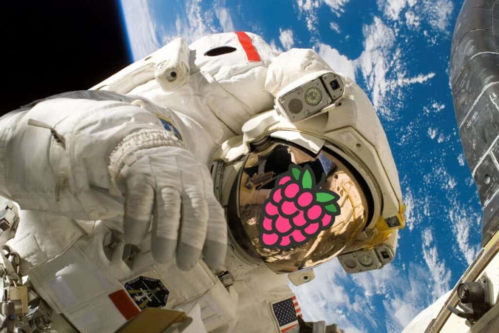 astronaut space walk with raspberry pi logo on his helmet